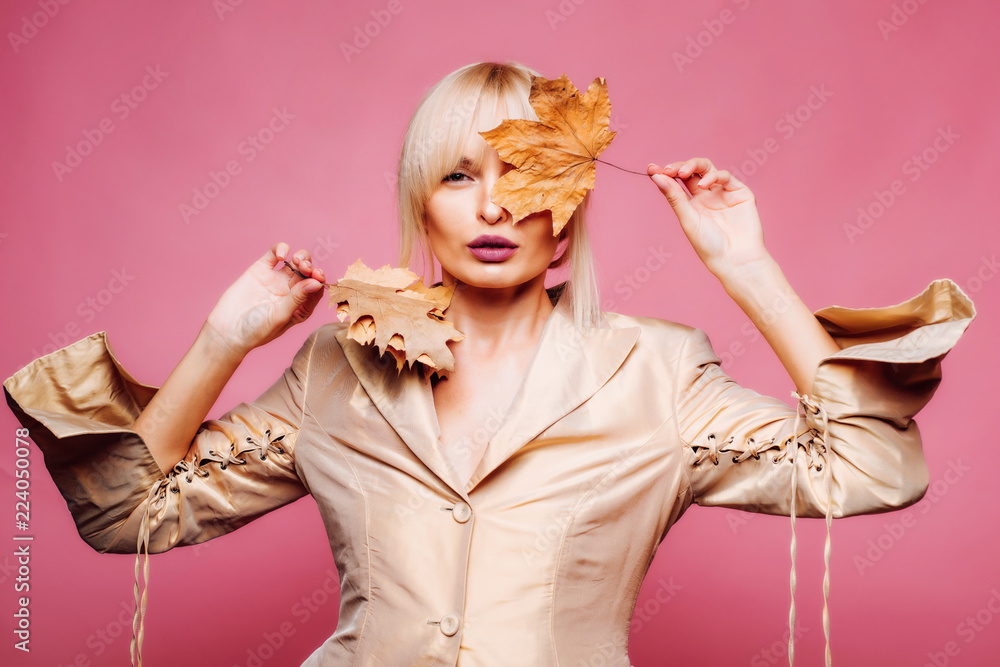 Fototapeta premium Sexy girl preparing for Autumn sale. Fashion portrait of beautiful sensual woman. Autumn mood and weather are warm and sunny. Autumn concept.