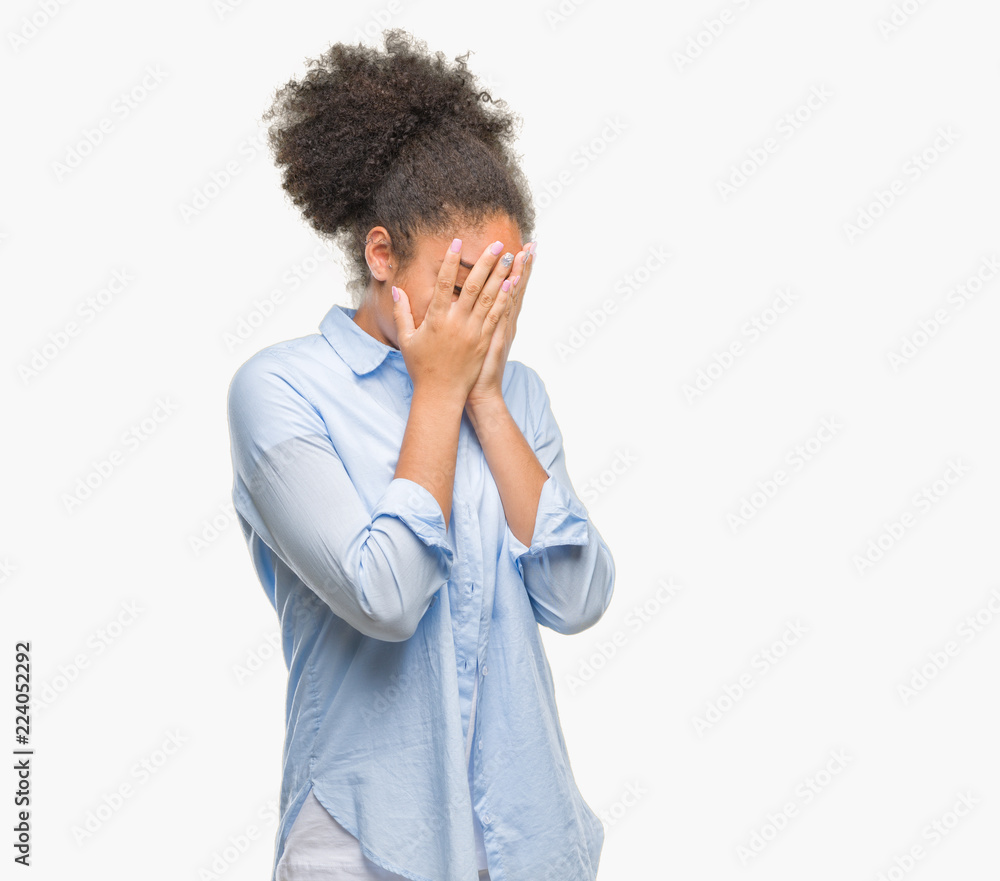 Young afro american woman over isolated background with sad expression covering face with hands while crying. Depression concept. Young afro american woman over isolated background with sad expression covering face with hands while crying. Depression concept.