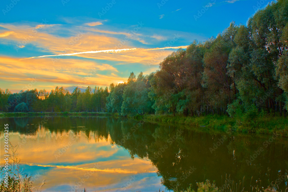 Lake and forest at dusk in autumn. Kostroma, Russia.