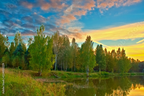 Lake and forest at dusk in autumn. Kostroma, Russia.