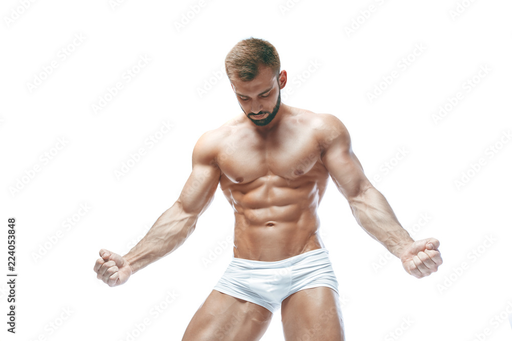 bodybuilder posing. Beautiful sporty guy male power. Fitness muscled manin white lingerie. on isolated white background.