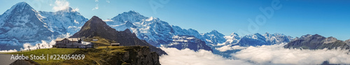 Panorama over Mannlichen at the Bernese Alps (Berner Oberland, Switzerland). It is a mountain (2,343 metre) reachable from Wengen with a aerial cableway or from Grindelwald using a gondola cableway. photo