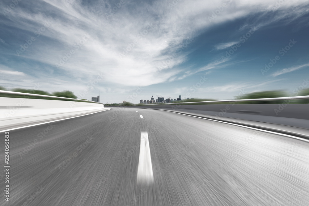 empty highway through modern city empty highway through modern city