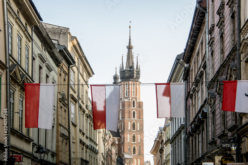 Flags on the Szczepańska street with the Basilica of Santa María in the background