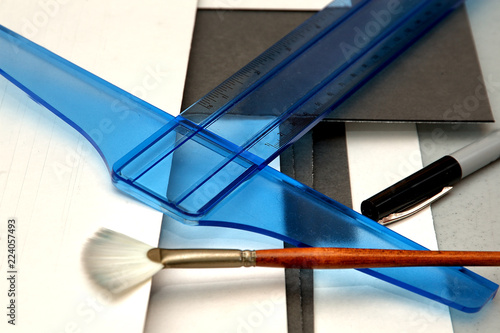 Wallpaper Mural A t-square, matboard, fan brush and pen, all tools used to mat and frame artwork. Torontodigital.ca