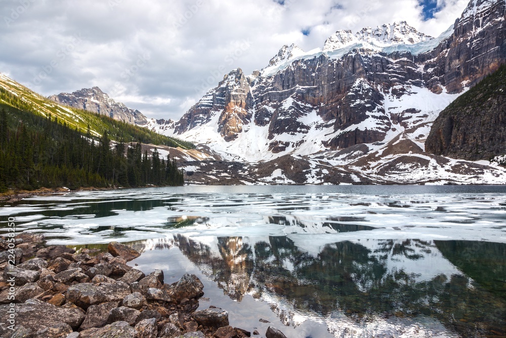 Mount Quadra Snowy Mountain Peak reflected in upper Consolation Lake, Banff National Park, Rocky Mountains, Alberta, Canada Mount Quadra Snowy Mountain Peak reflected in upper Consolation Lake, Banff National Park, Rocky Mountains, Alberta, Canada
