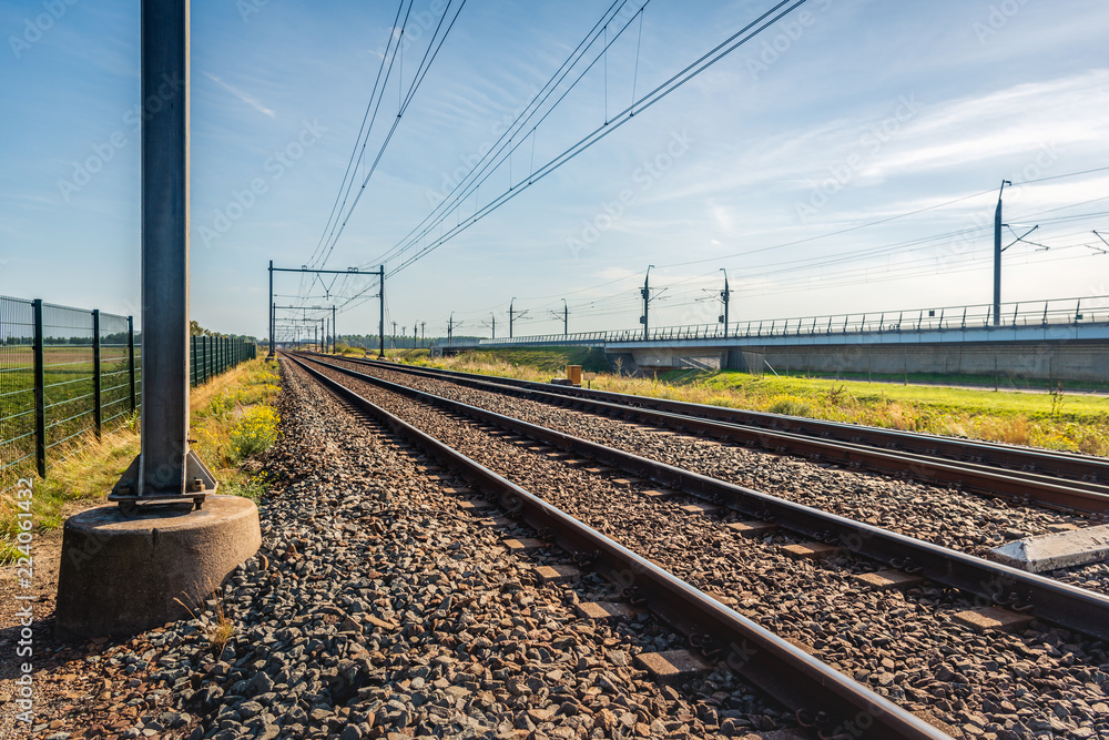 Train tracks on concrete sleepers and basalt gravel in the Netherlands