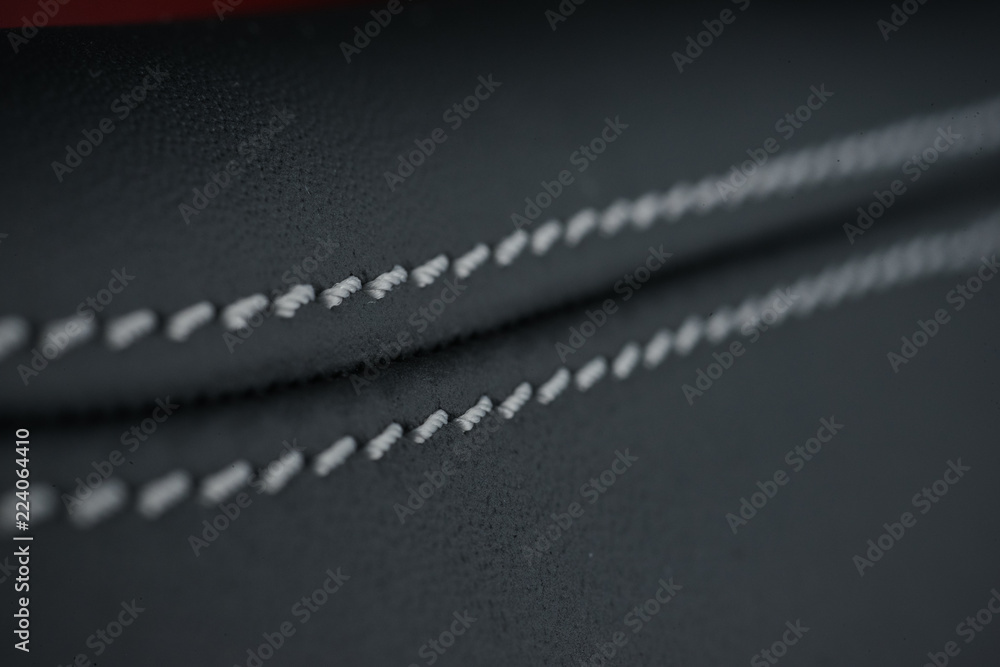 Detailed image of a car leather pleats stitch work.