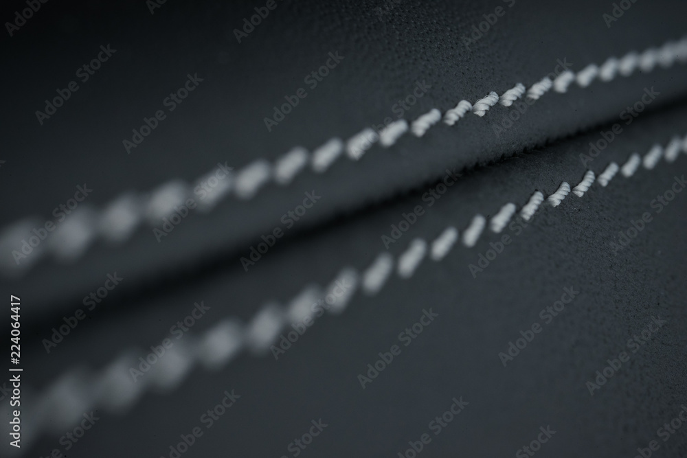 Detailed image of a car leather pleats stitch work.