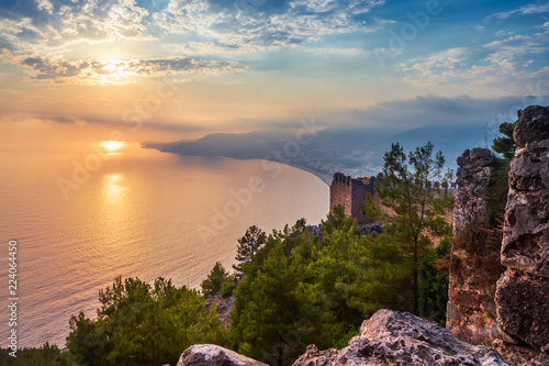 Принти на полотні Fortress wall on mountain view of sunset on sea