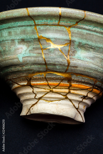 This is a bowl that I repaired using the Japanese art form of kintsugi with urushi lacquer and gold powder. photo