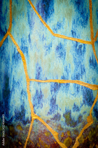 This is part of a vase I repaired with the Japanese art form of kintsugi with gold powder and urushi lacquer that was in 17 pieces when I started.