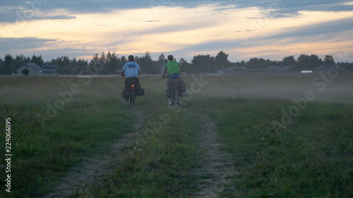 Bicyclists in the foggy field in Russia