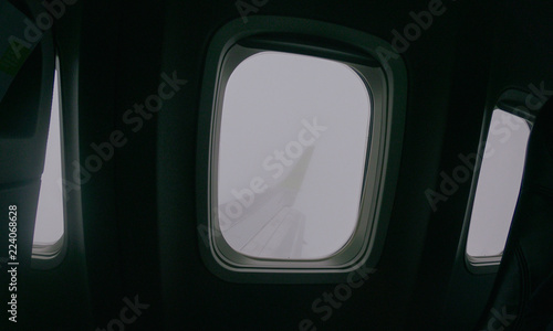 Aiplane Aircraft windows view on the wing aircraft, airlines , aviation skyline transportation