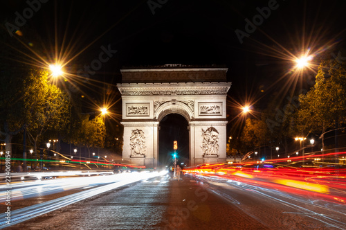 Arc de Triomphe at night, and traffic in Paris