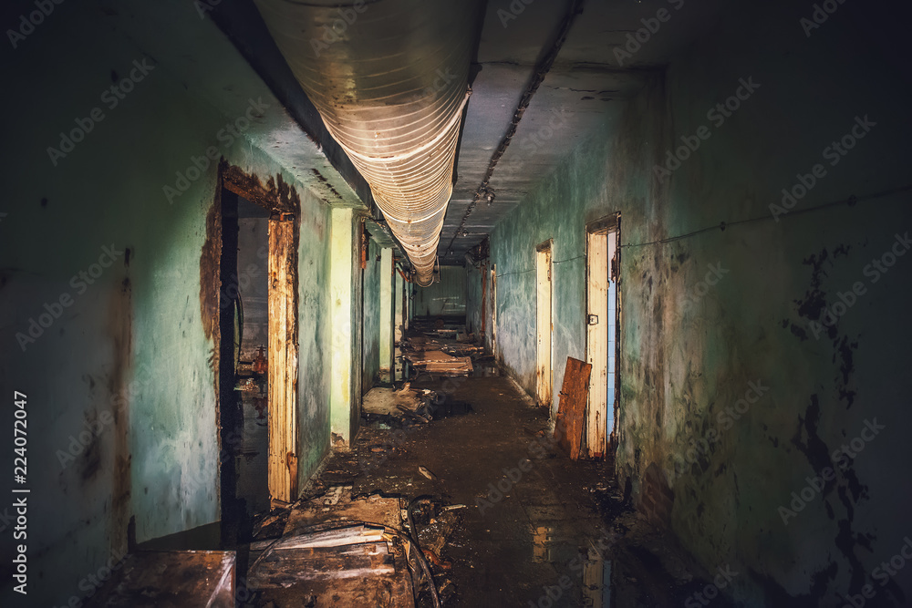 Dark flooded corridor or tunnel in old underground haunted and abandoned Soviet military bunker