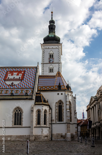 The Church of St. Mark, located in St. Mark's Square in Zagreb, Croatia, originated in the 13th century, reconstructed in the 14th century, featured the Zagreb Coat of arms on the roof.