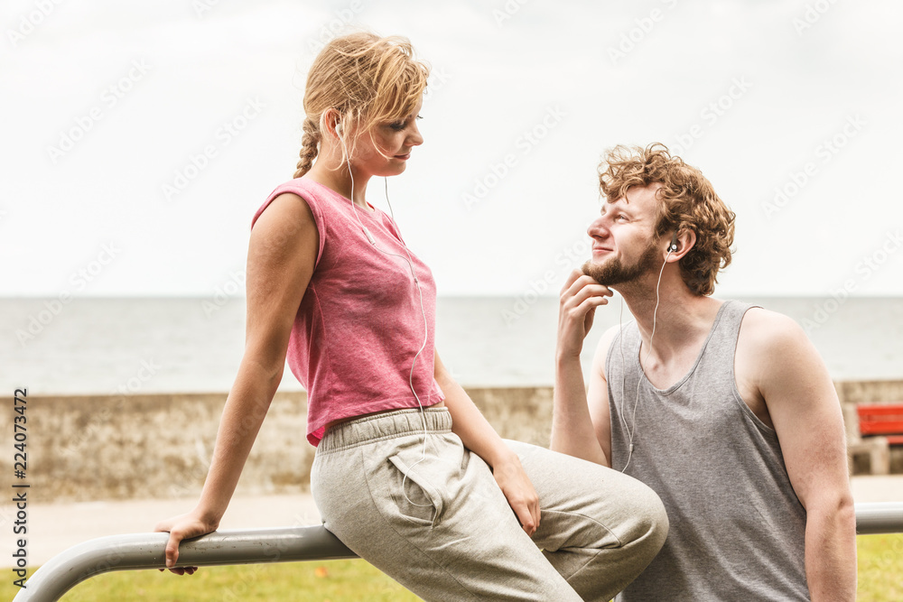 Man and woman relaxing listening to music.