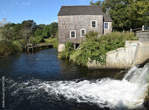 Mill house next to waterfall
