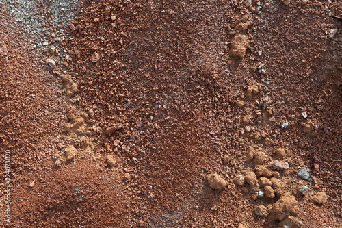 Red earth or soil background. Tropical laterite soil  background of red clay. Dry Orange surface, Picture of natural disaster. Drought land Caused by global warming and deforestation. photo