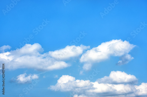 Fluffy white clouds on background of blue sky wallpaper