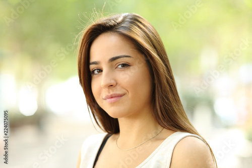 Portrait of a relaxed teen looking at camera in the street