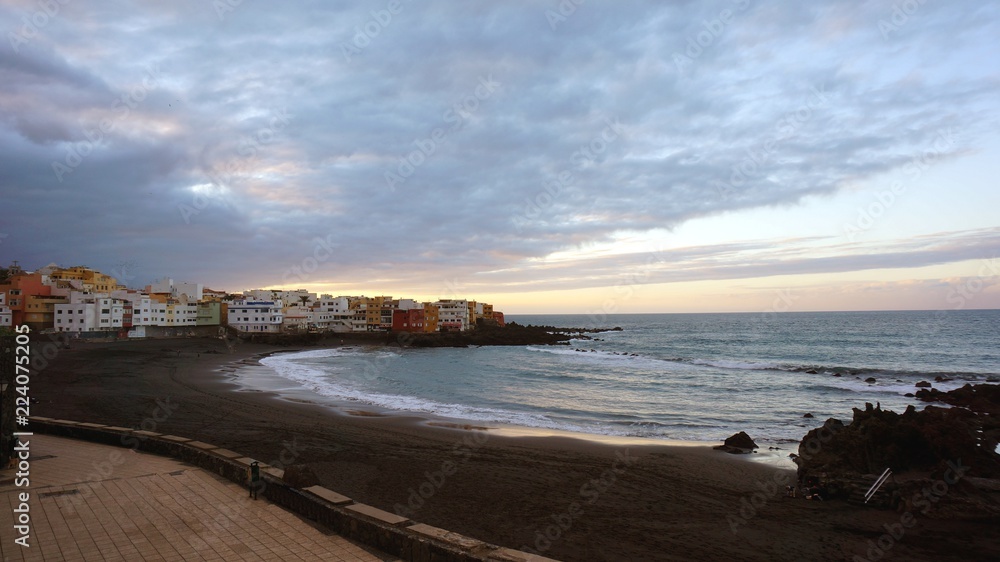 View of colourful houses of Punta Brava from Playa Jardin beach in Puerto de la Cruz, Tenerife, Canary Islands, Spain