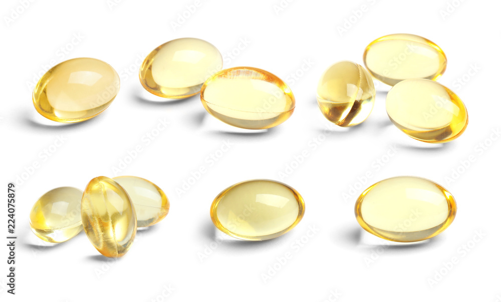 Set with cod liver oil pills on white background Set with cod liver oil pills on white background