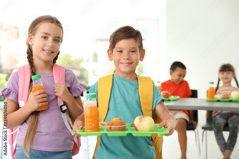 Children with healthy food at school canteen Stock Photo