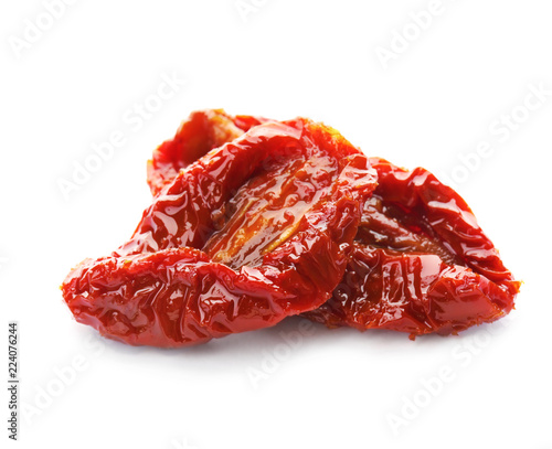 Tasty sun dried tomatoes on white background