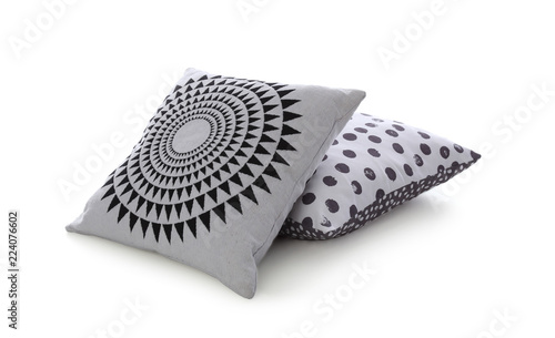 Different colorful pillows on white background