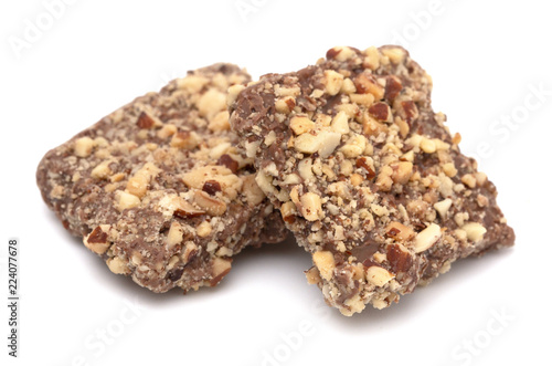 Schilderij op canvas Chocolate Covered English Toffee Coated in Nuts on a White Background