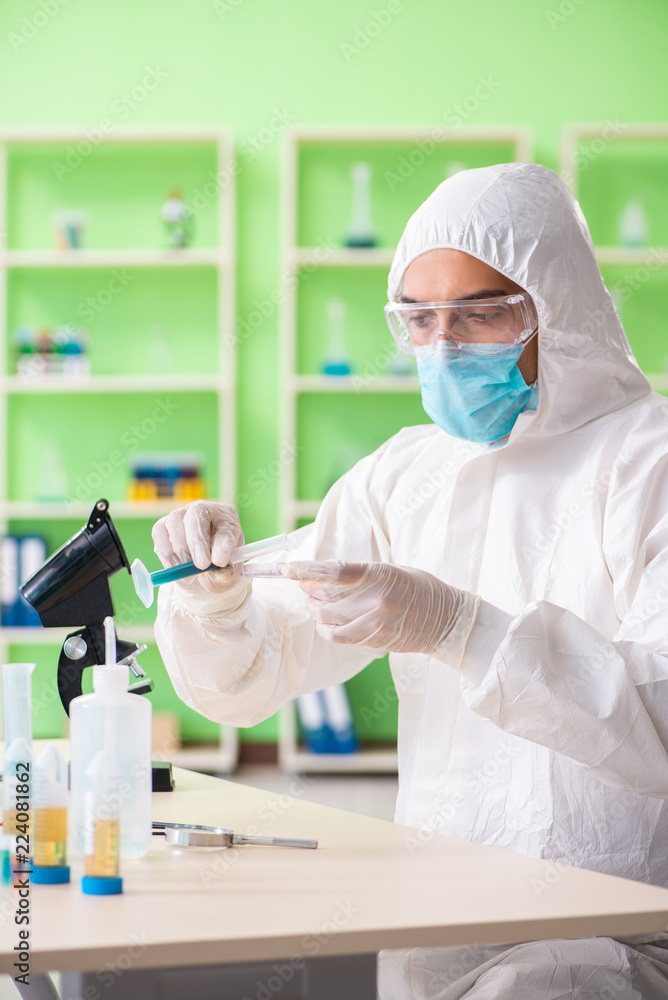 Chemist working in the lab on new experiment Chemist working in the lab on new experiment