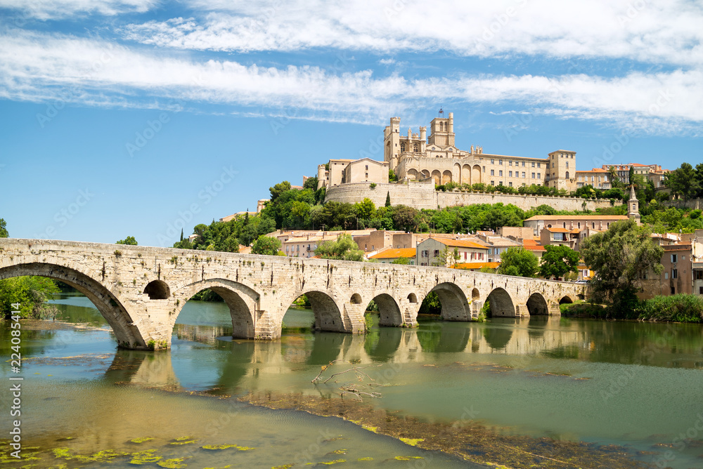 Old bridge and Saint Nazaire cathedral on the Orb river in Beziers, France