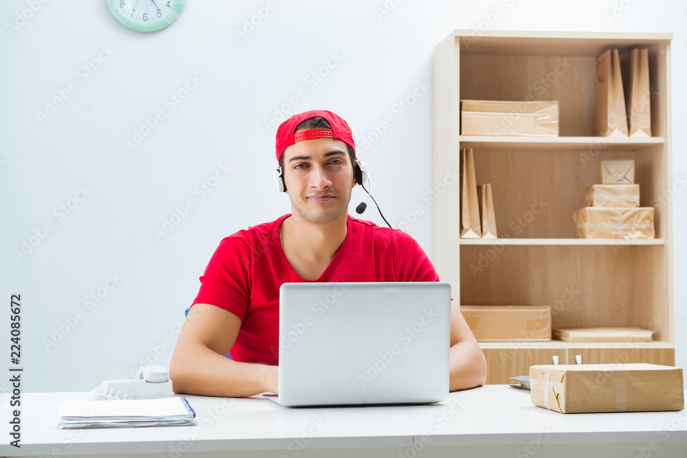 Call center worker at parcel distribution center in post office Call center worker at parcel distribution center in post office