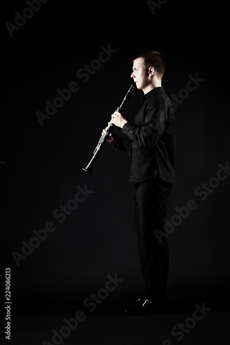 Clarinet player classical musician. Man playing clarinette