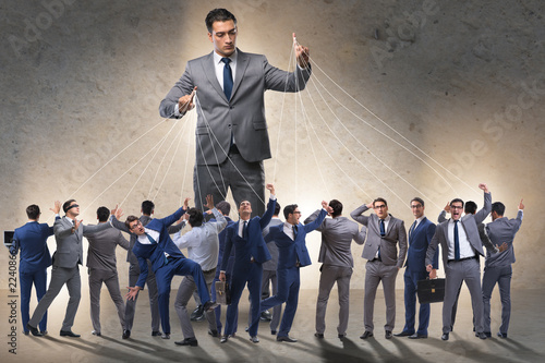 Boss employee manipulating his staff in business concept