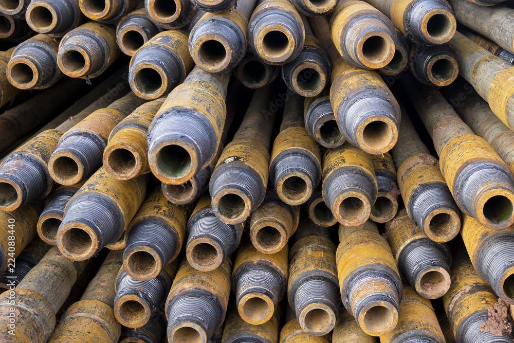 Drilling of oil and gas wells. Drill pipe inspection. Tubing for oil and gas listed on the pedestal out of the wells after washing and ready for inspection. Stack of casing laying on the deck Drilling of oil and gas wells. Drill pipe inspection. Tubing for oil and gas listed on the pedestal out of the wells after washing and ready for inspection. Stack of casing laying on the deck