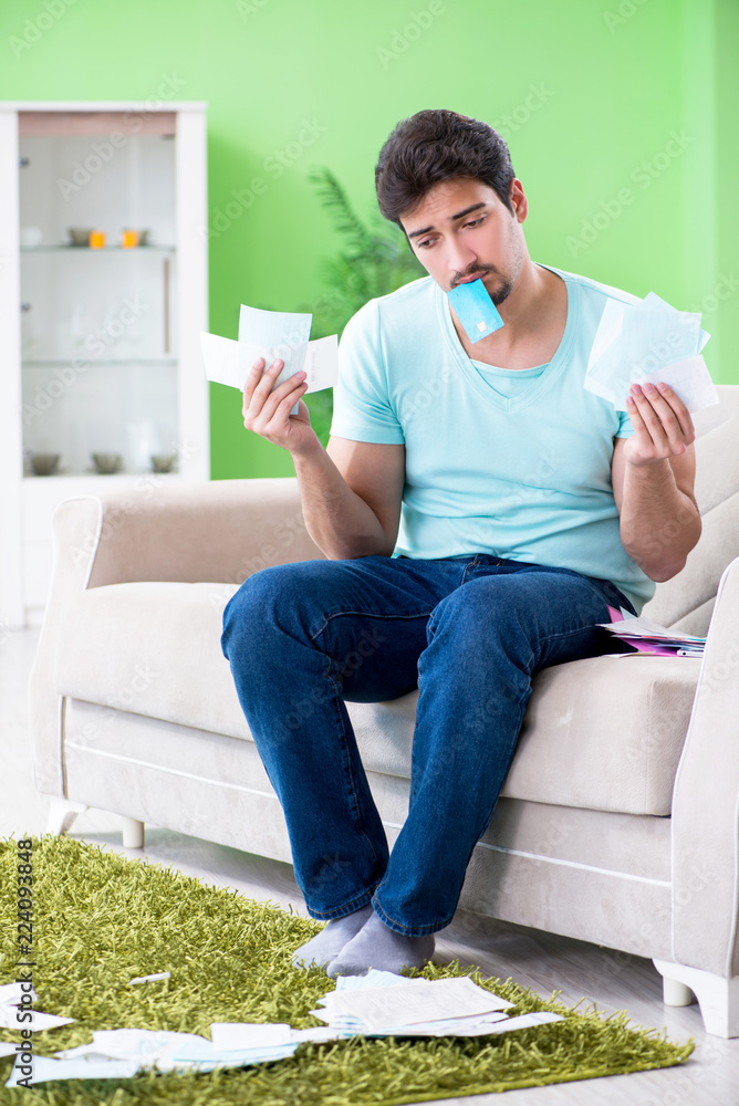 Young man struggling with personal finance and bills Young man struggling with personal finance and bills