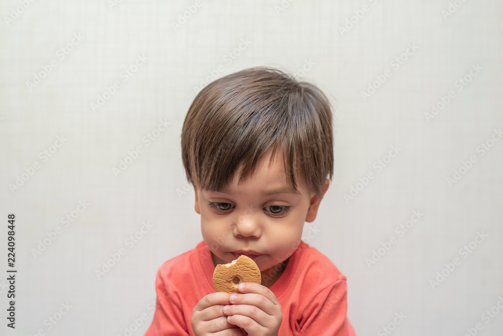 Cute baby boy toddler - eating wafer biscuit Cute baby boy toddler - eating wafer biscuit