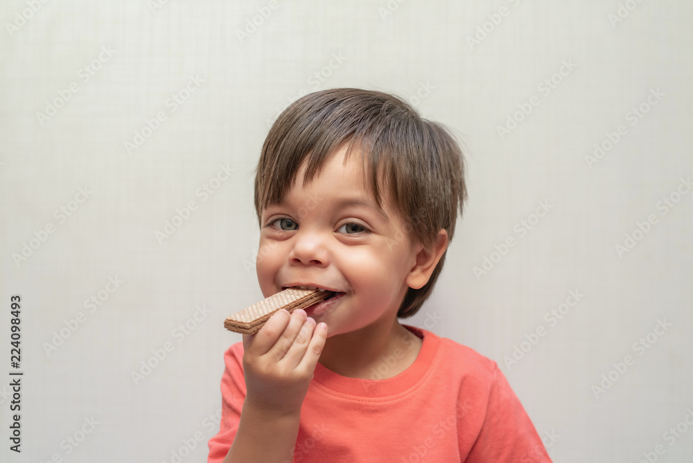Cute baby boy toddler - eating wafer biscuit Cute baby boy toddler - eating wafer biscuit