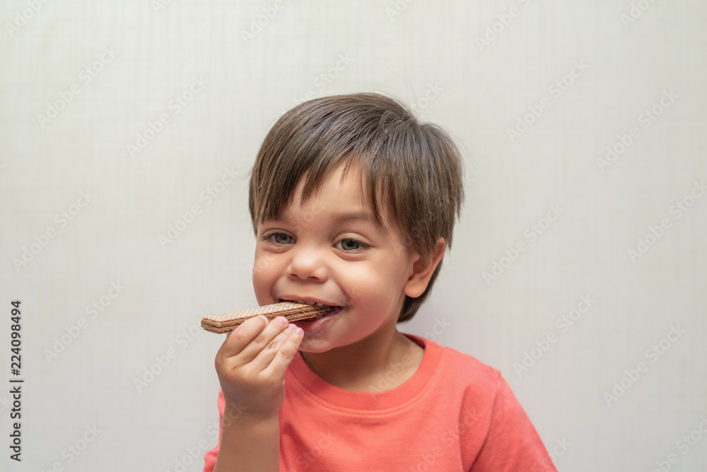Cute baby boy toddler - eating wafer biscuit Cute baby boy toddler - eating wafer biscuit
