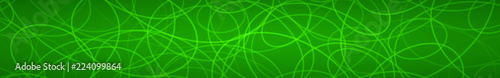 Abstract horizontal banner of randomly arranged contours of elipses on green background