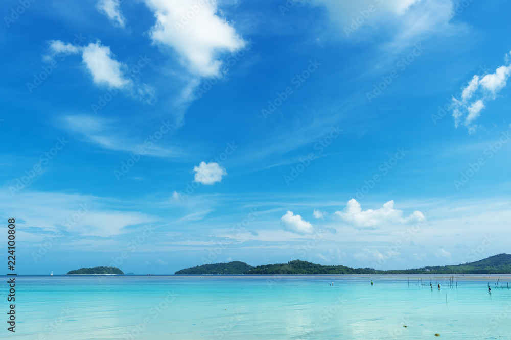 Tranquil seascape in sunny day..Tropical blue sea and cloudy blue sky at andaman seashore in summertime,wide angle view. .