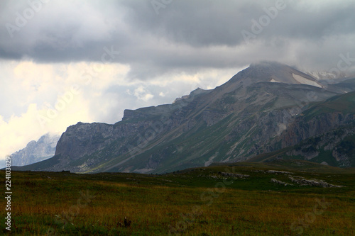 cute nordic mountain landscape with heavy clouds, natural landscape photo