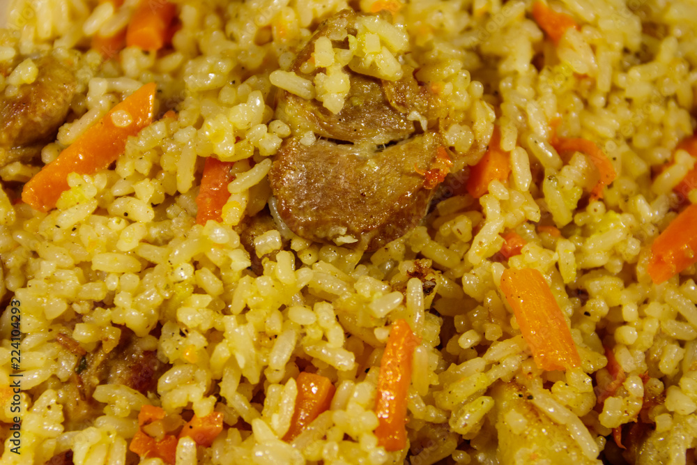 Pilaf with meat, rice, carrot and onion. Close-up Pilaf with meat, rice, carrot and onion. Close-up
