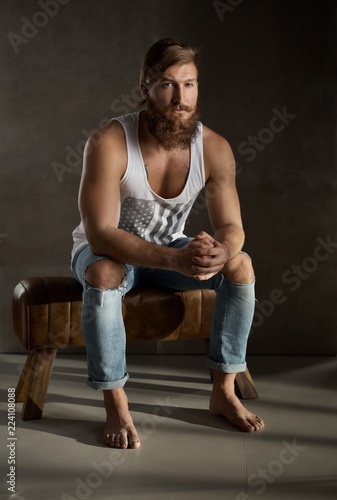 Full length portrait of young bearded man