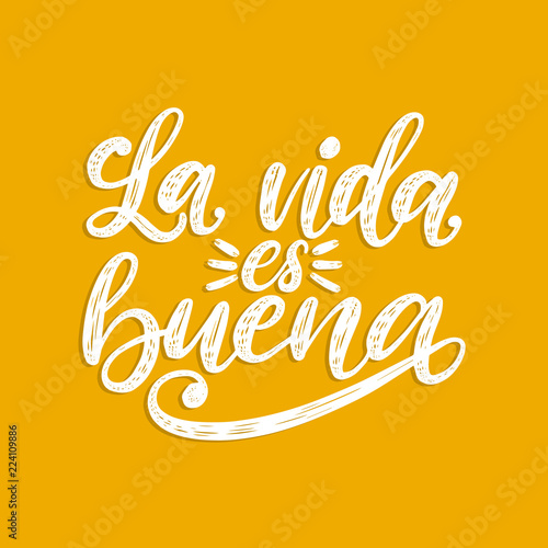 La Vida Es Buena translated from Spanish Life Is Good handwritten phrase on yellow background.Vector inspirational quote