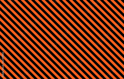 Orange and black diagonal stripes with copy space, graphic resource as abstract background, textile print, wallpaper and geometric inspiration