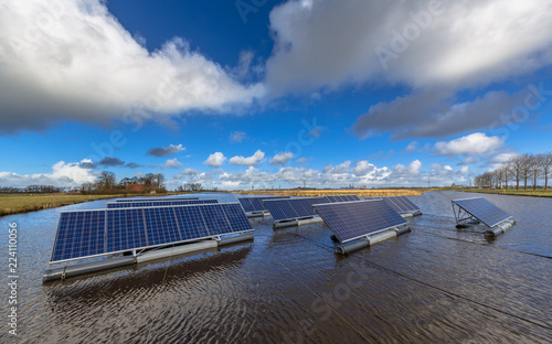 Group of Solar panels floating on water photo